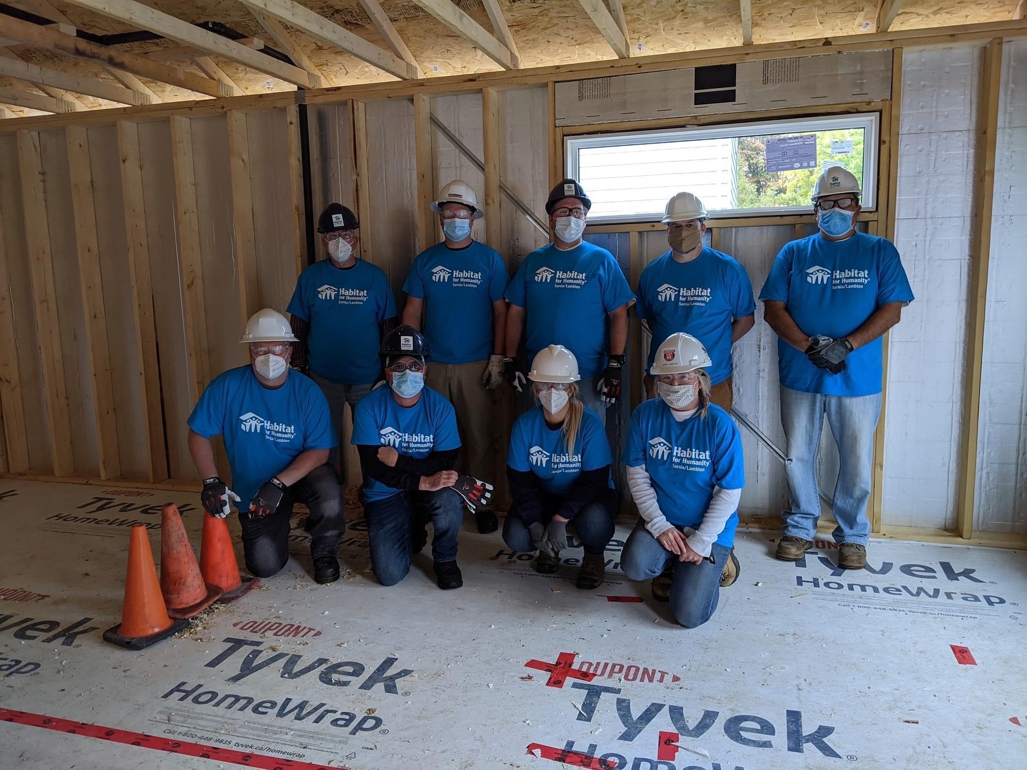 Team in Corunna, ON volunteering at a Habitat for Humanity build
