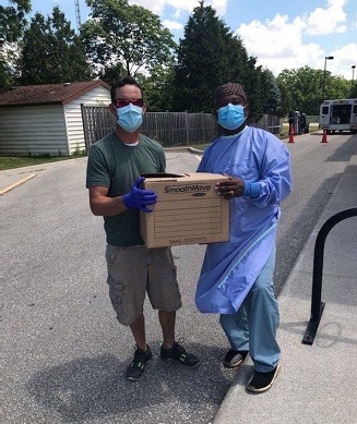 Joel Weed, Technician in Corunna, ON, donating masks to Dr. Daniel of Bluewater Health Joel Weed, Technician in Corunna, ON, donating masks to Dr. Daniel of Bluewater Health
